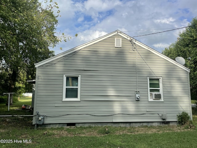 view of home's exterior featuring crawl space and cooling unit