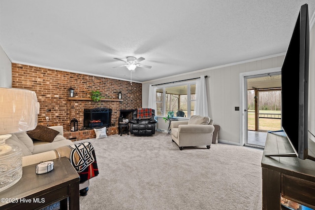 living area with plenty of natural light, carpet, a brick fireplace, and ornamental molding