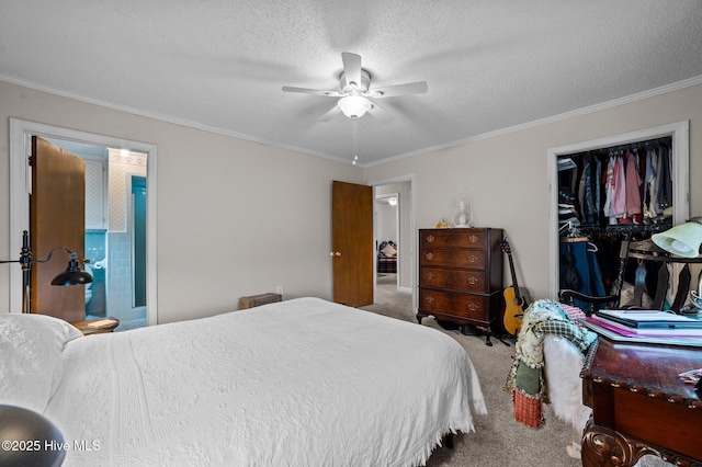 carpeted bedroom featuring a textured ceiling, ceiling fan, and ornamental molding