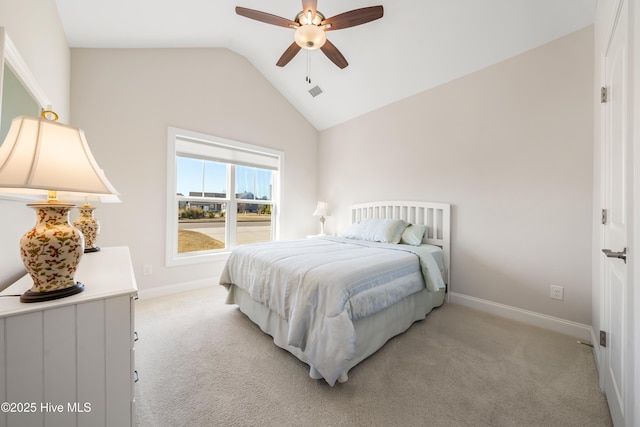 bedroom featuring vaulted ceiling, light colored carpet, and baseboards