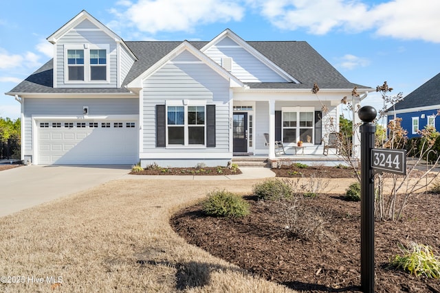 view of front of home featuring an attached garage, a porch, concrete driveway, and roof with shingles