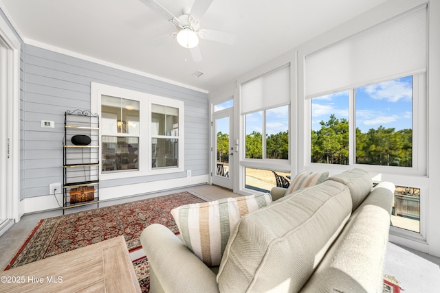 sunroom / solarium with ceiling fan