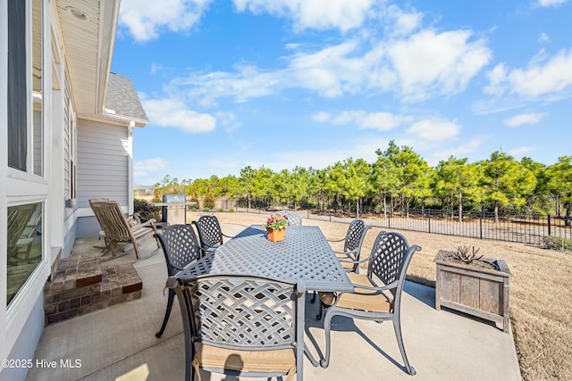 view of patio featuring a fenced backyard and outdoor dining space