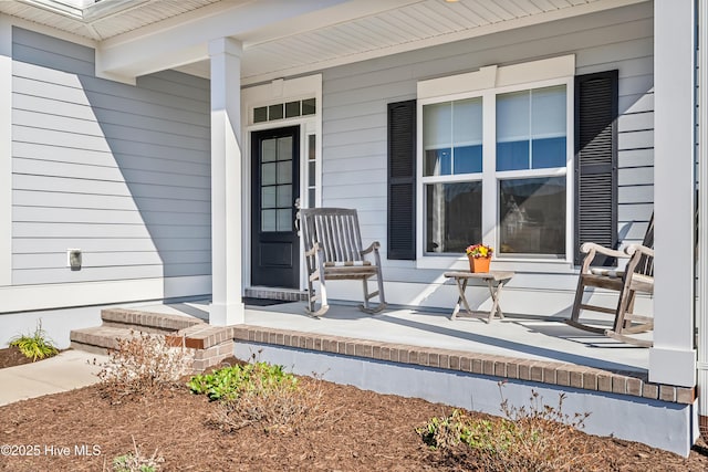 doorway to property with covered porch