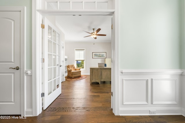 hall with french doors, dark wood-style flooring, and ornamental molding