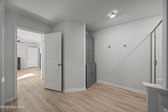 interior space with light wood-type flooring and baseboards