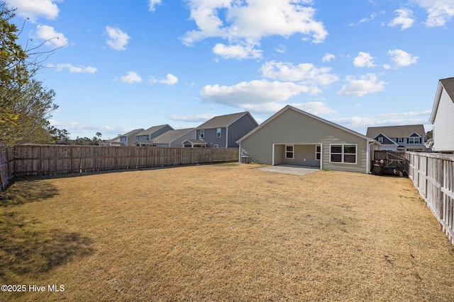 view of yard with a fenced backyard and a patio area