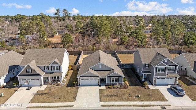 birds eye view of property with a residential view