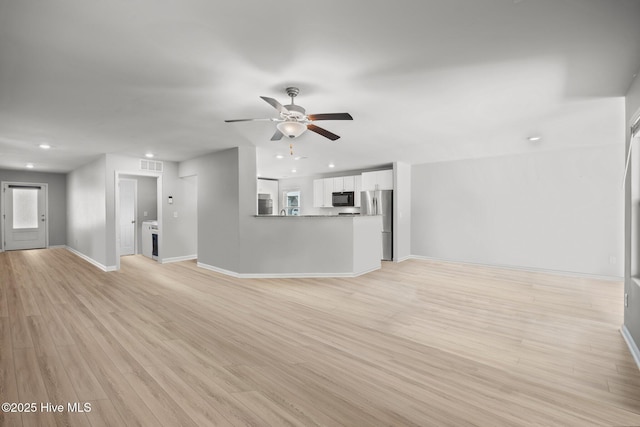 unfurnished living room featuring visible vents, baseboards, light wood-type flooring, recessed lighting, and a ceiling fan