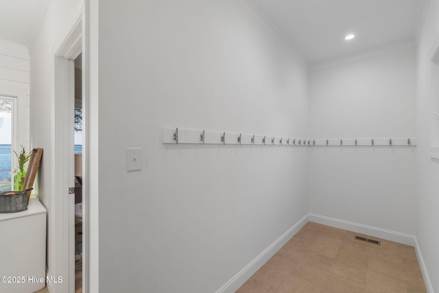 hallway featuring recessed lighting, visible vents, baseboards, and crown molding