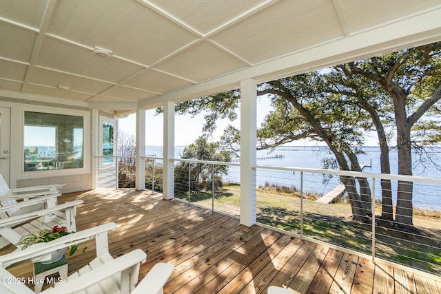 wooden terrace with a water view