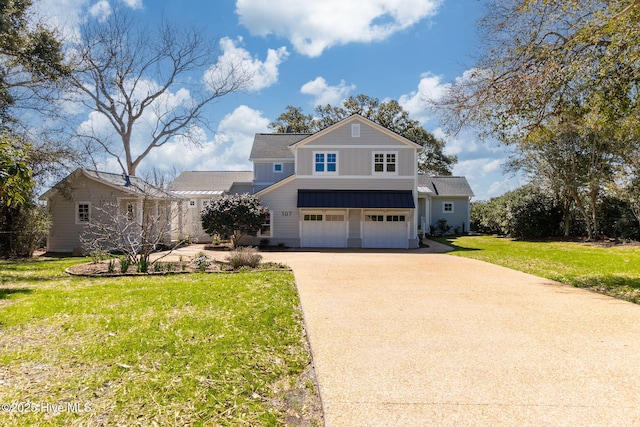 traditional home featuring a front lawn, a garage, board and batten siding, and concrete driveway