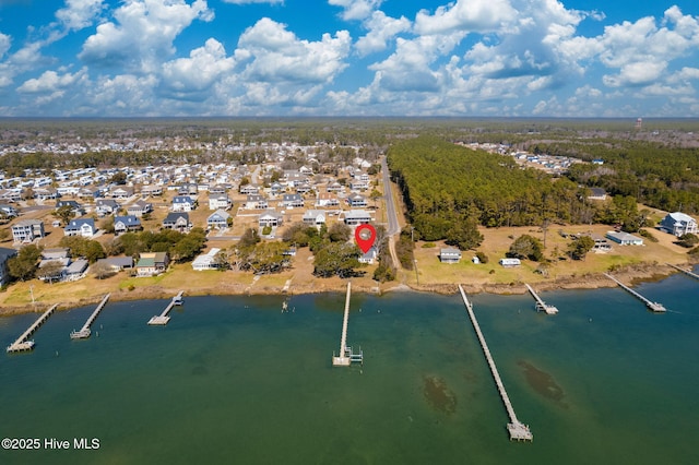 drone / aerial view featuring a residential view and a water view