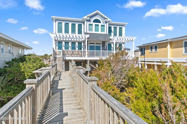 rear view of house with a pergola