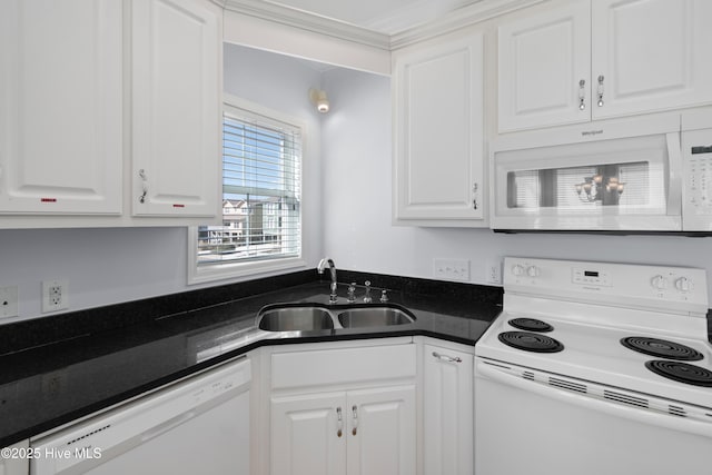 kitchen featuring a sink, white appliances, dark countertops, and white cabinets