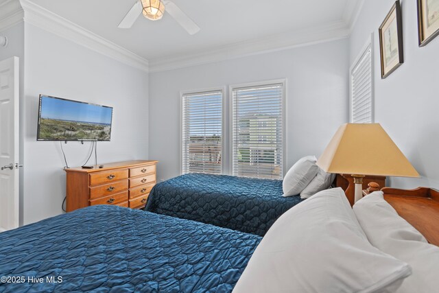 bedroom with a ceiling fan and crown molding