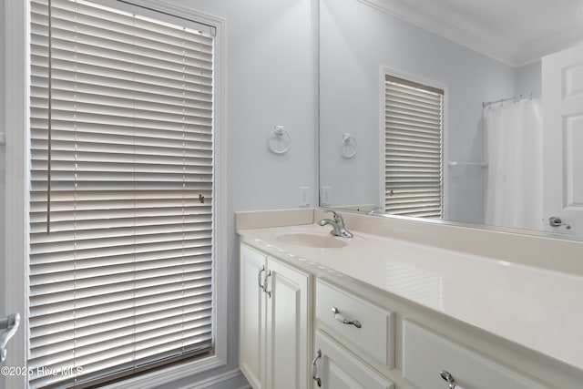 bathroom with vanity and crown molding