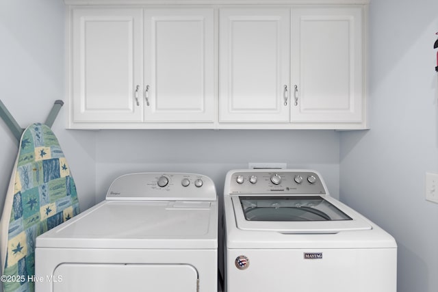 laundry area featuring cabinet space and separate washer and dryer