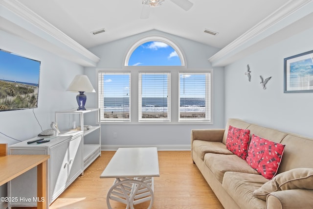 living area with vaulted ceiling, light wood-style floors, visible vents, and baseboards