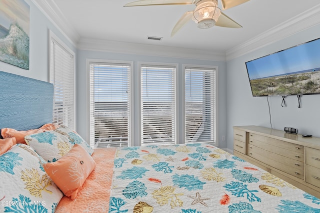 bedroom with crown molding, multiple windows, and visible vents