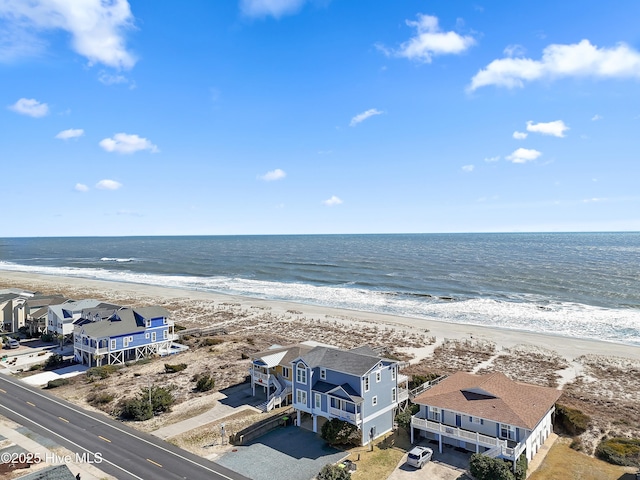 aerial view featuring a residential view, a beach view, and a water view