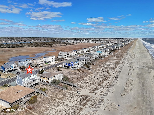 drone / aerial view featuring a beach view