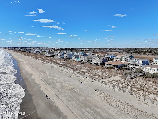 aerial view featuring a residential view, a beach view, and a water view