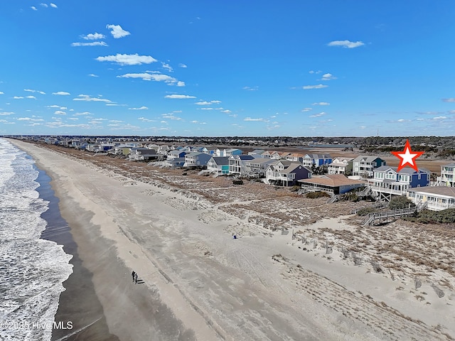 water view featuring a view of the beach and a residential view