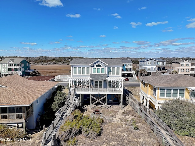 back of property featuring a residential view