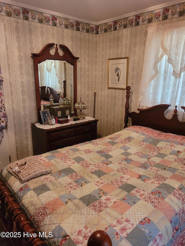 bedroom with wallpapered walls