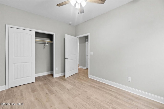 unfurnished bedroom with wood finished floors, baseboards, a closet, and ceiling fan