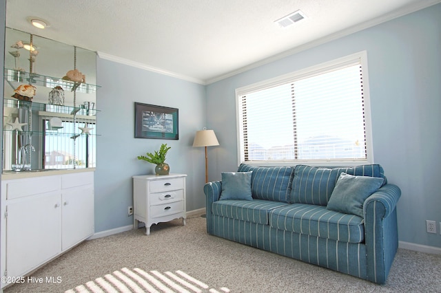 living area with visible vents, light colored carpet, crown molding, and baseboards