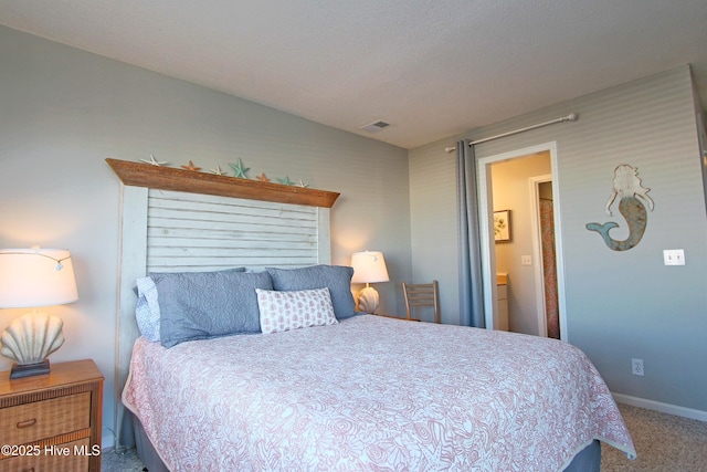 carpeted bedroom featuring visible vents and baseboards