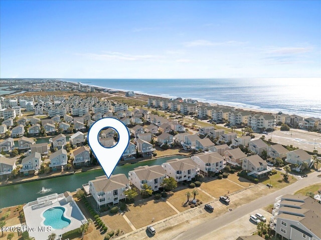 birds eye view of property featuring a residential view and a water view