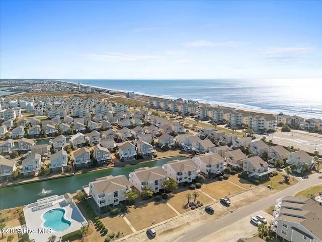 drone / aerial view featuring a residential view and a water view