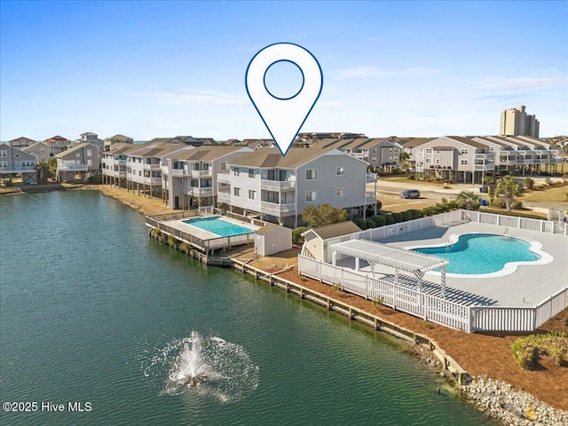 bird's eye view with a residential view and a water view