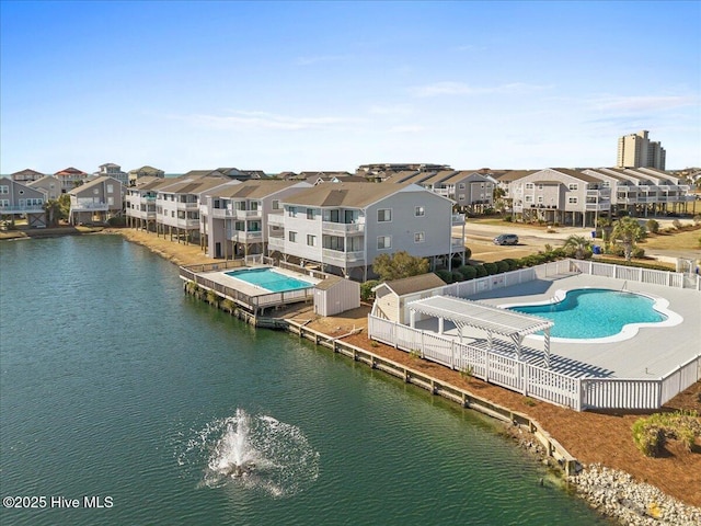 aerial view featuring a residential view and a water view