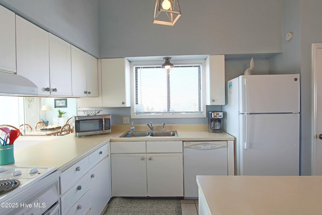 kitchen featuring white cabinetry, white appliances, light countertops, and a sink