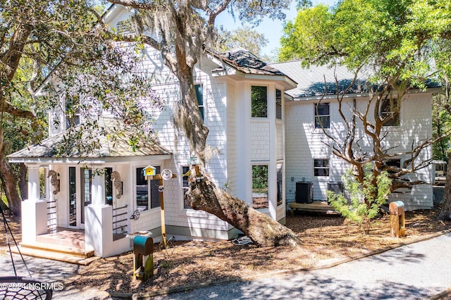 view of front of property featuring a porch and central AC