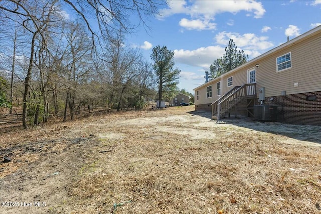 view of yard with central AC