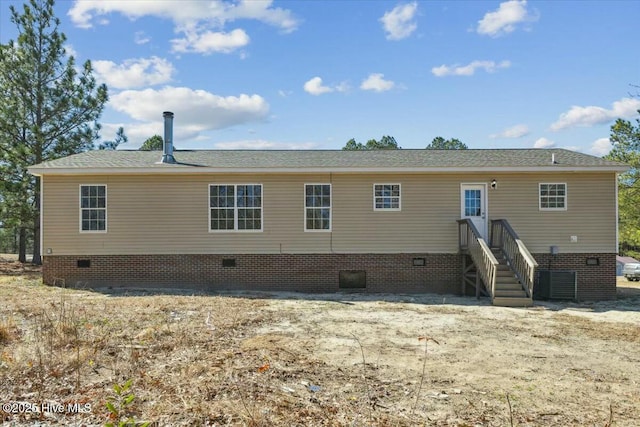 back of house featuring crawl space