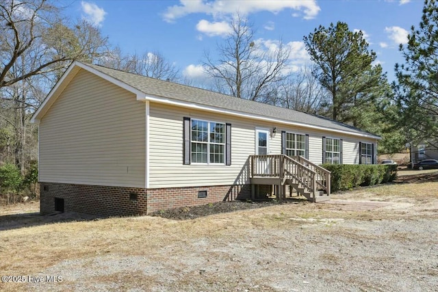 manufactured / mobile home with crawl space and a shingled roof