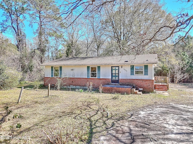 single story home with brick siding