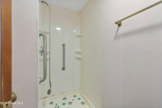 full bath featuring a shower stall