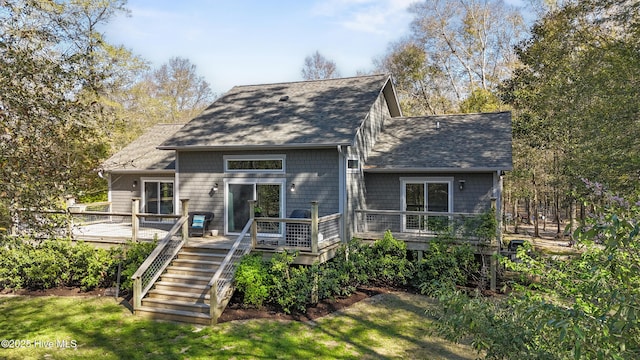 8808 Nadie Ln, Wilmington, NC 28411 - rear view of property with a shingled roof, a wooden deck, and stairs