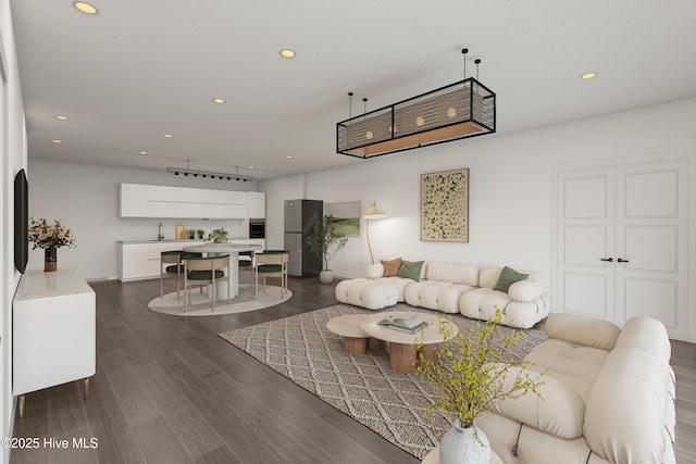living area with recessed lighting and dark wood-style flooring