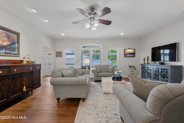 living area with recessed lighting, baseboards, ceiling fan, and light wood finished floors