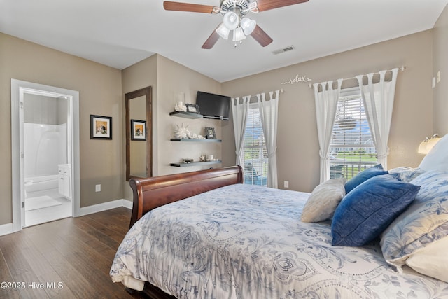 bedroom featuring visible vents, connected bathroom, baseboards, dark wood-style floors, and a ceiling fan