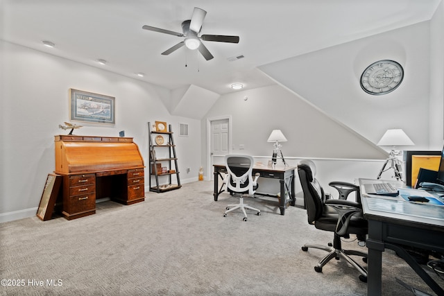 office area with lofted ceiling, carpet flooring, a ceiling fan, and visible vents