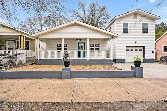 view of front of house featuring a garage, covered porch, driveway, and ceiling fan